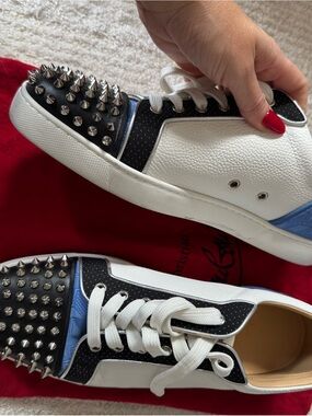 White and Black Studded Sneakers with Blue Accents